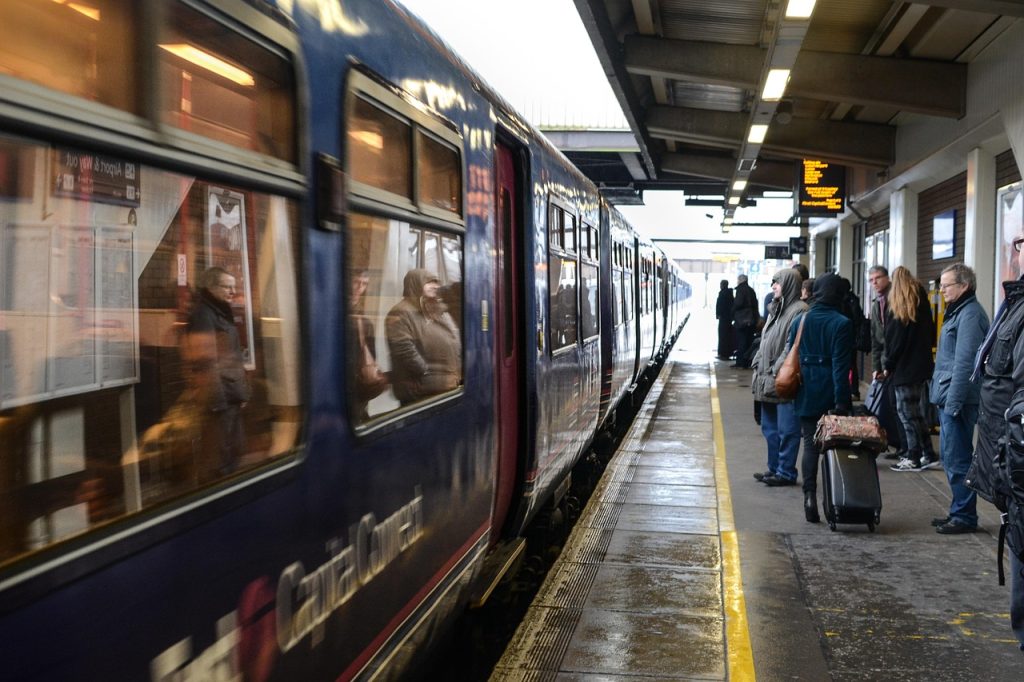 People waiting for a train at a railway station platform