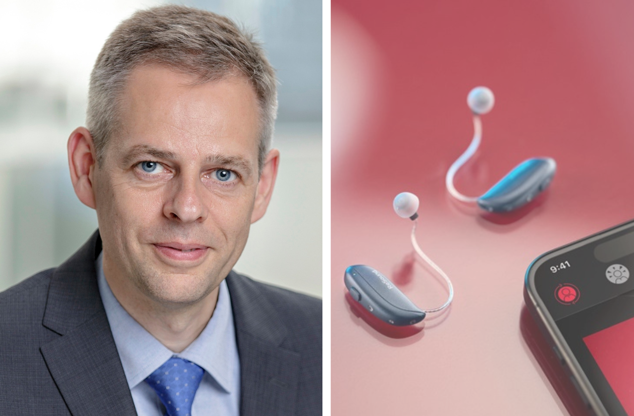 Thomas Olsgaard next to the GN Group ReSound Vivia hearing aids and the left hand corner of a mobile phone