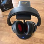 The earisMAX headphones on the charging cradle