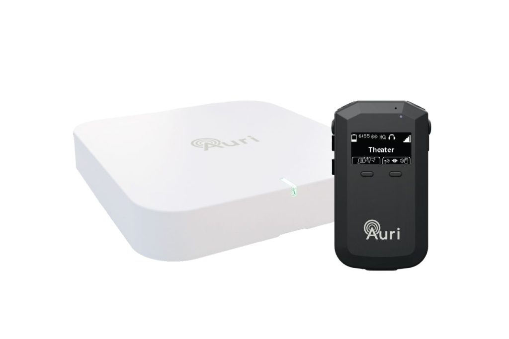 The Ampetronic Auri system - a router-type white box with a receiver, which is the size and shape of a pebble
