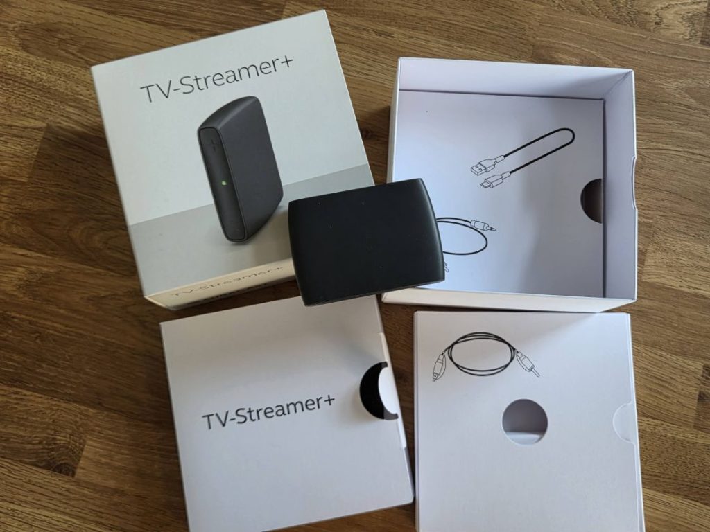The GN ReSound TVStreamer+, its box and interior packaging
