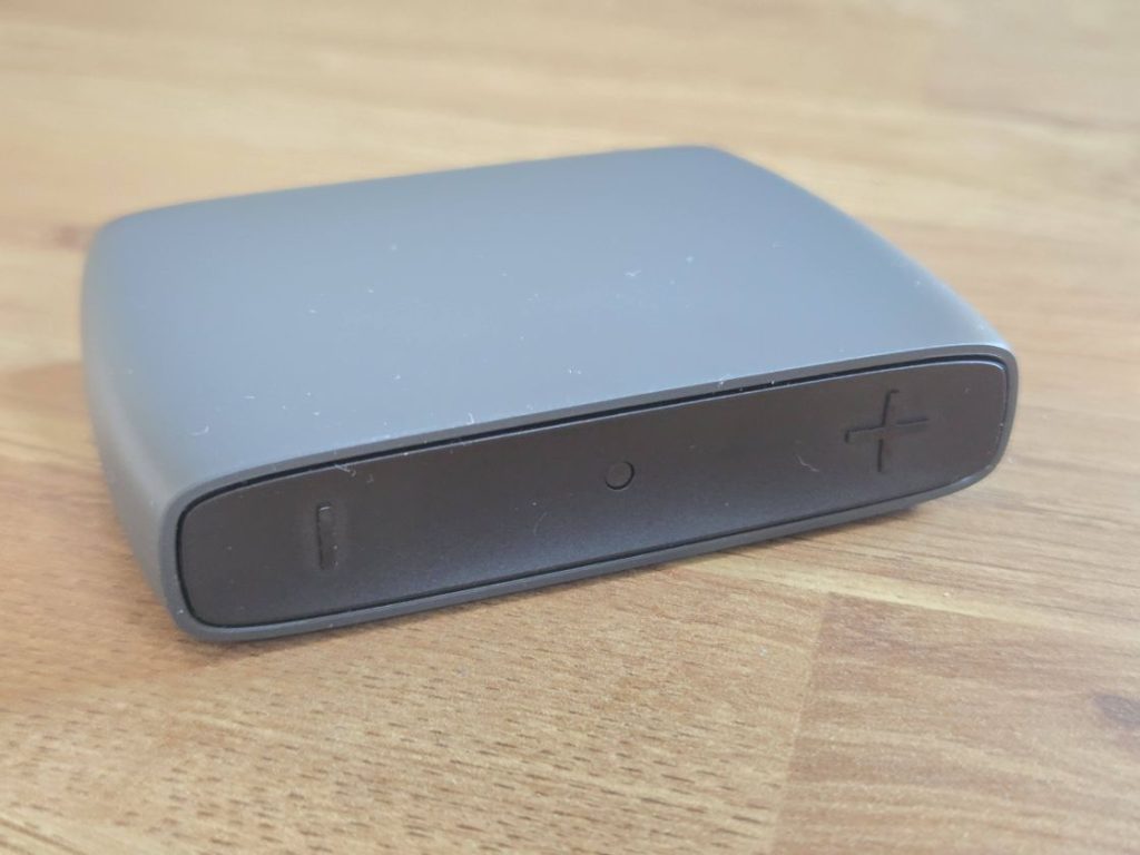 The GN ReSound TVStreamer+ on a wooden table