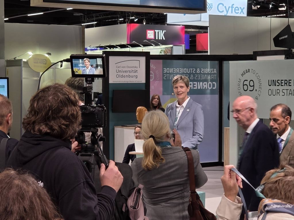 Beate Gromke, the EUHA president, giving her opening address surrounded by lots of people