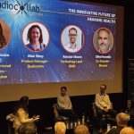 A panel of experts on stage at the AudioCollab event