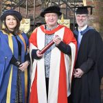 The University of Reading presented an honorary degree to Aurahear.co.uk's Phil Creighton (pictured centre). All three people are wearing ceremonial robes for an academic institution.