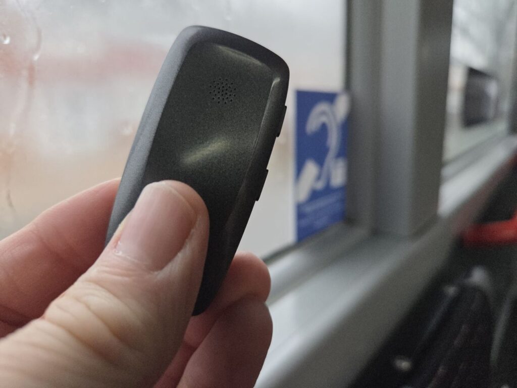 A ReSound MultiMIc+ next to a Telecoil sign on a Reading Bus