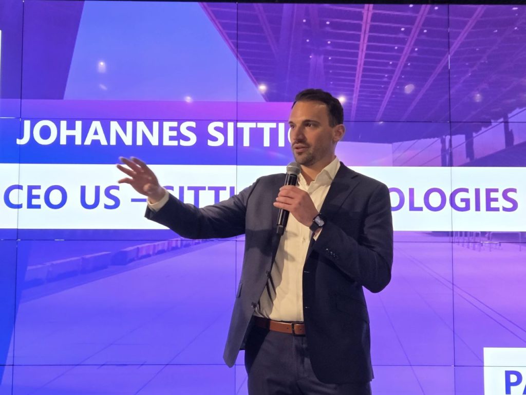 Johannes Sittig with an arm slightly raised to make a point