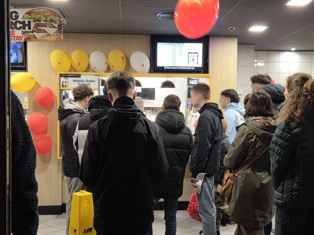 People waiting for their number to be called in McDonald's 