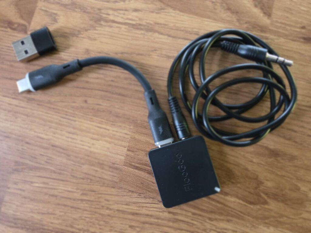 The FlooGoo FMA121 with a USB-C cable and a 3.5mm headphone cable