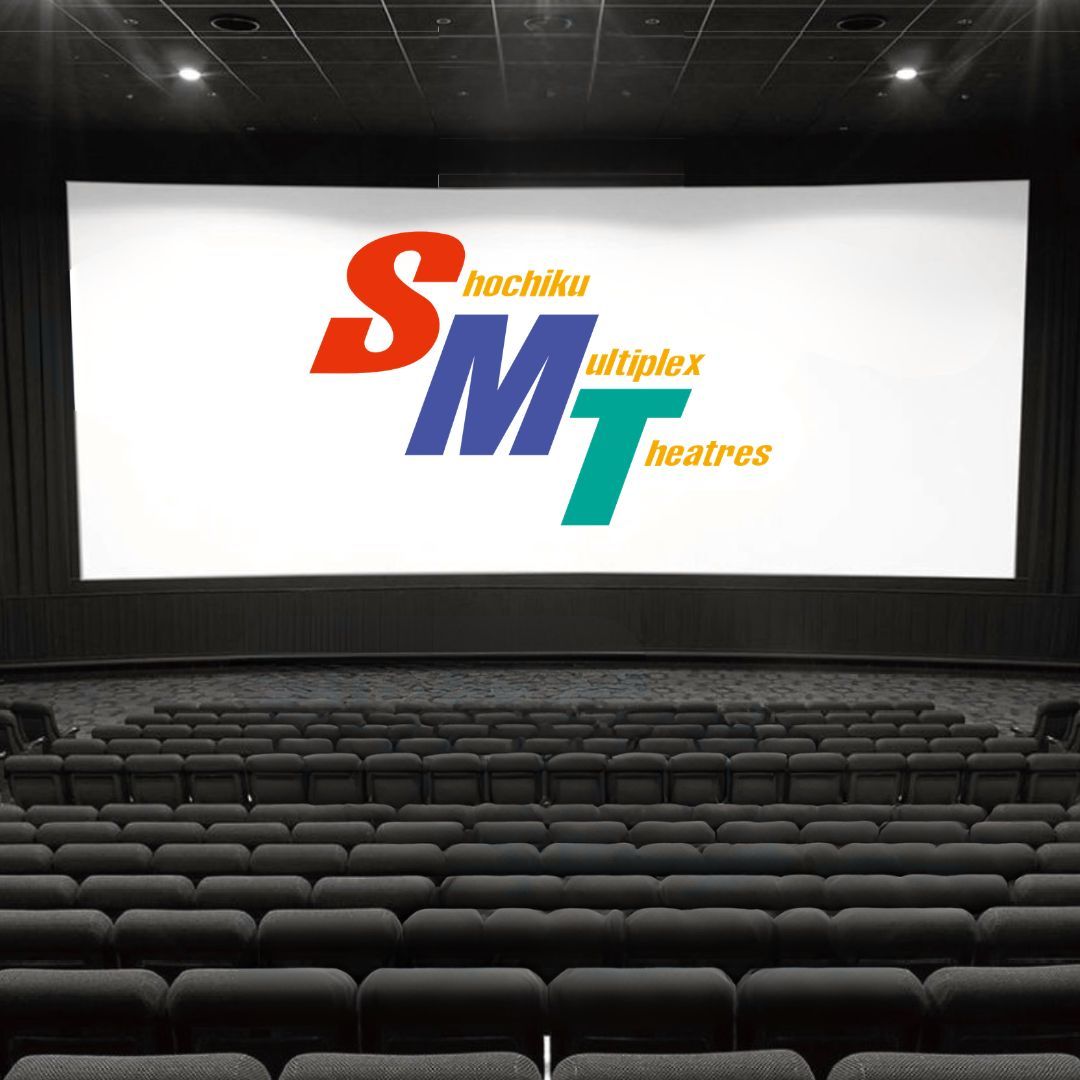 Movix - a cinema screen with seats. The lights are down and no one is sitting in the seats. The Screen has the logo SMT