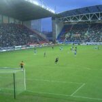 The JJB Stadium with a game of football being played