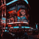 The exterior of the Sondheim Theatre at night Samuel regan asante unsplash