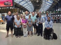 A group of people on the concourse of Brighton Station