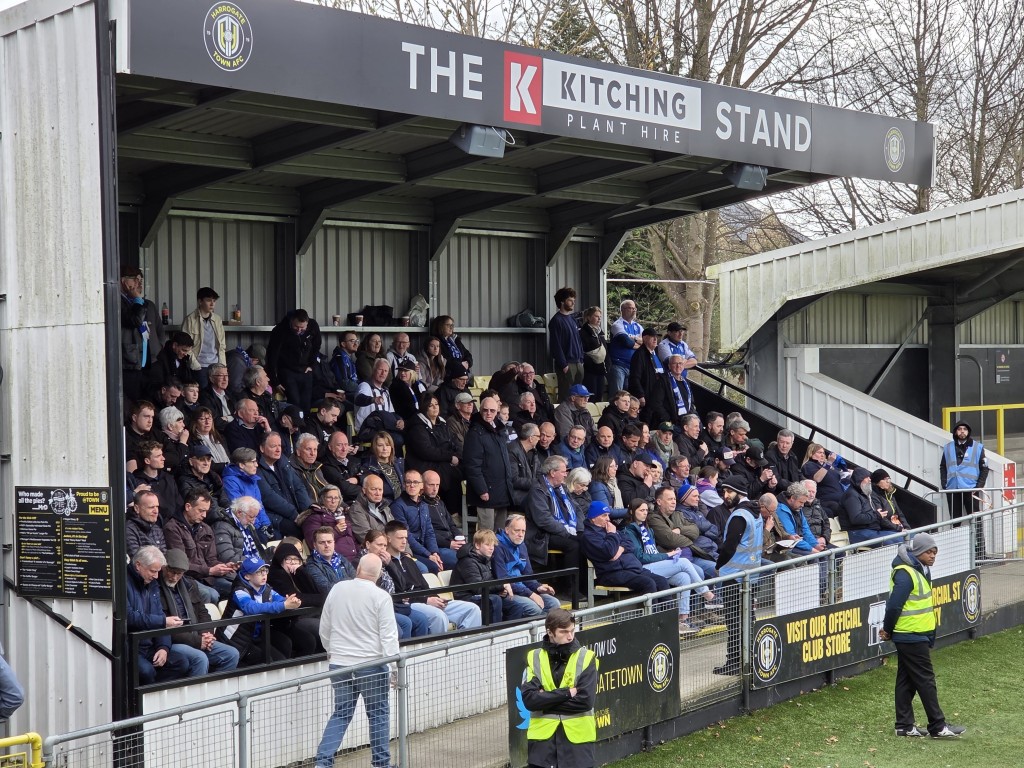 A small stand packed with supporters