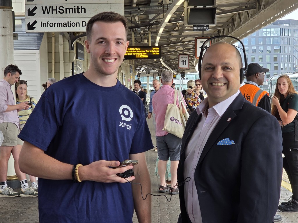 Two people standing next to each other at Bristol Temple Meads railway station