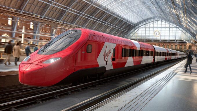 A mock-up of a high-speed Virgin Trains service at London St Pancras International station. The red train, with red and white livery on the carriages and engine, is on tracks, under the large, historic, arched glass and iron roof. The station clock is visible in the background, and there are passengers walking on the platform next to the train.