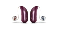A pair of deep plum Oticon Reveal miniRITE hearing aids featuring clear domes and speaker wires against a white background.